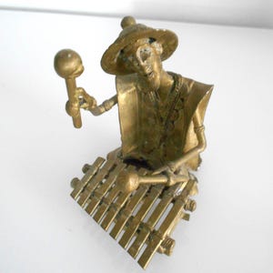 brass sculpture African art musician