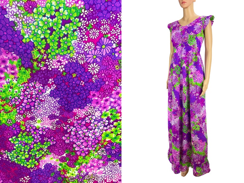 May include: A long purple maxi dress with a floral print featuring pink, green, and white flowers. The dress has a scoop neck and short sleeves with ruffles.