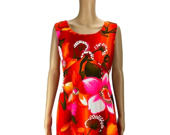 May include: A sleeveless dress with a vibrant orange background and a large floral print featuring pink, white, and orange flowers. The dress has a scoop neckline and a fitted bodice.