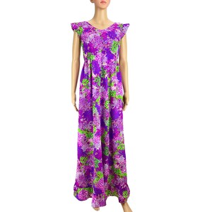 May include: A long purple dress with a green and pink floral print. The dress has short sleeves with ruffles and a gathered skirt.