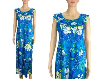 May include: A blue maxi dress with a white and green floral print. The dress has a scoop neck and a ruffled neckline.