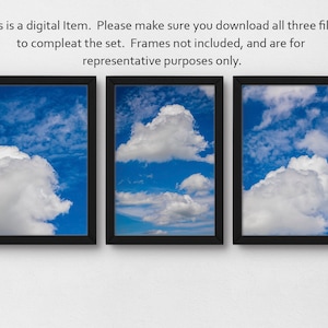 May include: Three framed prints of a blue sky with white clouds. The frames are black and the prints are arranged in a row.