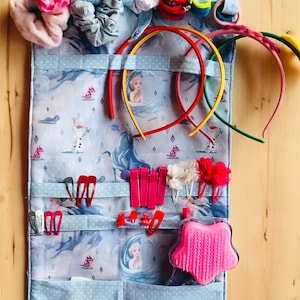 Foldable travel organizer for clothespins and headbands
