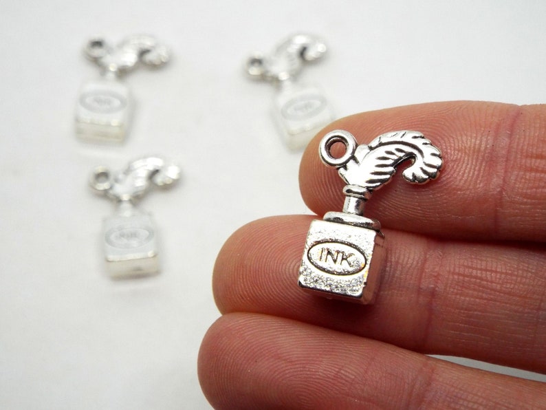 BULK 50 Bone charms silver tone A300
