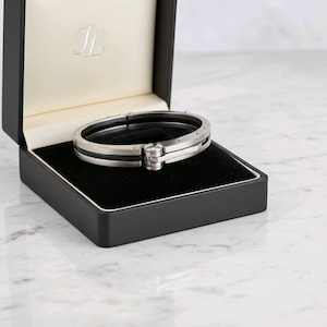 Pulsera de pulsera para hombre, de acero inoxidable plateado y negro, estilo brazalete.