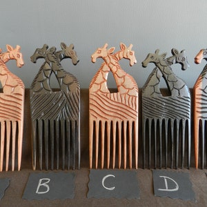 May include: Five wooden combs with giraffe designs. The combs are in different colors, including natural wood, black, and gray. The combs are labeled A through E.