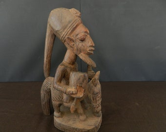 Shango priest on his donkey carrying a bowl, offering to the god Shango, Figure equestrian wooden altar, hat Voodoo ritual, High 14.17 "