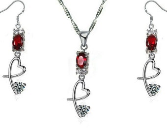 Crossed silver heart set with crystal and diamond topaz, stone of your choice