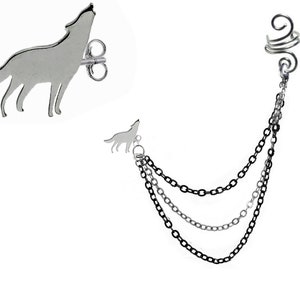 May include: Silver-toned wolf-themed jewelry set. Includes a stud earring with a howling wolf silhouette and an ear cuff with three chain dangles. The chains are in shades of silver and black. A unique accessory for those who love animal-inspired designs.