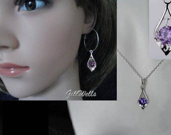 “Creole set with chiseled silver leaf and amethysts”