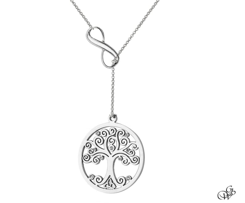 May include: A silver necklace with an infinity symbol charm and a pendant featuring a detailed tree of life design with small clear stones.