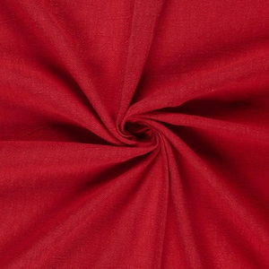 May include: A close-up shot of a vibrant red fabric, artfully draped and swirled to create a central vortex. The texture of the material is visible, with subtle variations in the color and a soft sheen.