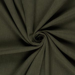 May include: Close-up of olive green fabric with a soft, textured appearance. The fabric is arranged in a spiral, creating a swirling pattern. The color is a deep, earthy tone, suitable for various textile projects.