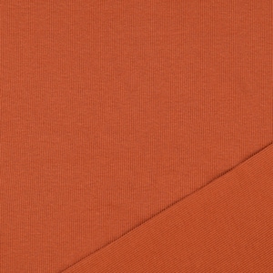 May include: Close-up of a textured, burnt orange fabric. The fabric has a ribbed pattern, with a diagonal section of the same material. The color is a warm, earthy tone, suitable for apparel or home decor.