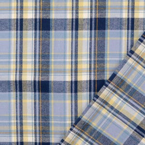 May include: Close-up of a fabric with a plaid pattern. The fabric features a combination of light blue, navy blue, yellow, and white colors. The plaid design is composed of intersecting vertical and horizontal lines, creating a grid-like pattern. The fabric is folded over on the right side.