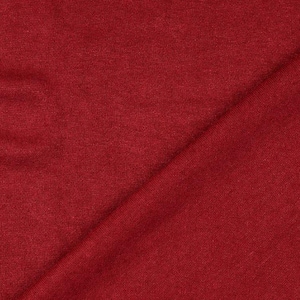 May include: Close-up of a solid red fabric with a subtle texture. The material is folded diagonally across the frame, creating a play of light and shadow. The fabric appears to be a medium weight, suitable for apparel or home decor.