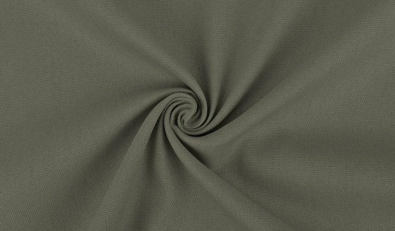 May include: Close-up of a textured, green fabric with a swirling pattern. The fabric is soft and has a subtle sheen.
