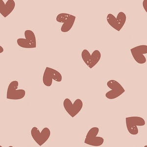 May include: A seamless pattern featuring a repeating design of brown hearts on a light pink background.