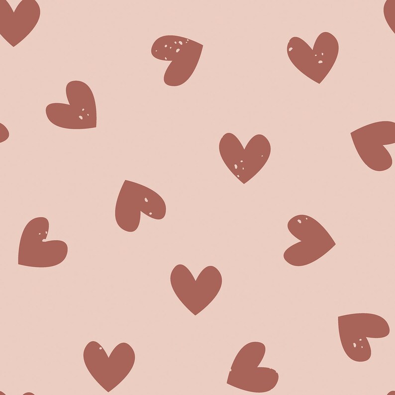 May include: A seamless pattern featuring a repeating design of brown hearts on a light pink background.