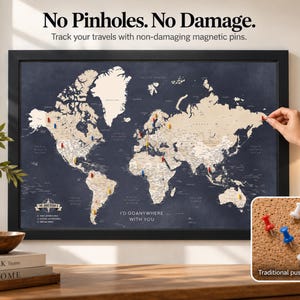 May include: A framed world map with a dark blue background and beige continents, featuring magnetic pins. Text reads: No Pinholes. No Damage. Track your travels with non-damaging magnetic pins. I'D GOANYWHERE WITH YOU. Includes a small inset showing colorful push-pins.