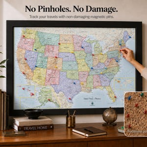 May include: A framed wall map of the United States featuring colorful states and magnetic pins. The text reads: No Pinholes. No Damage. Track your travels with non-damaging magnetic pins. An inset shows a cork board with traditional push-pin maps.
