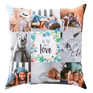 May include: Square cushion with a collage of family photographs. The cushion displays images of people, a dog, and the text "ALL YOU NEED IS LOVE" framed by floral designs. A soft, decorative item for the home.