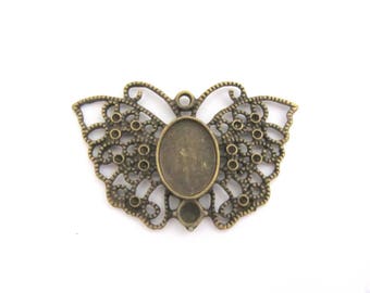 Un support cabochon, pendentif, papillon bronze pour cabochon 10x14