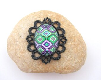 A black pendant with Abstract glass cabochon