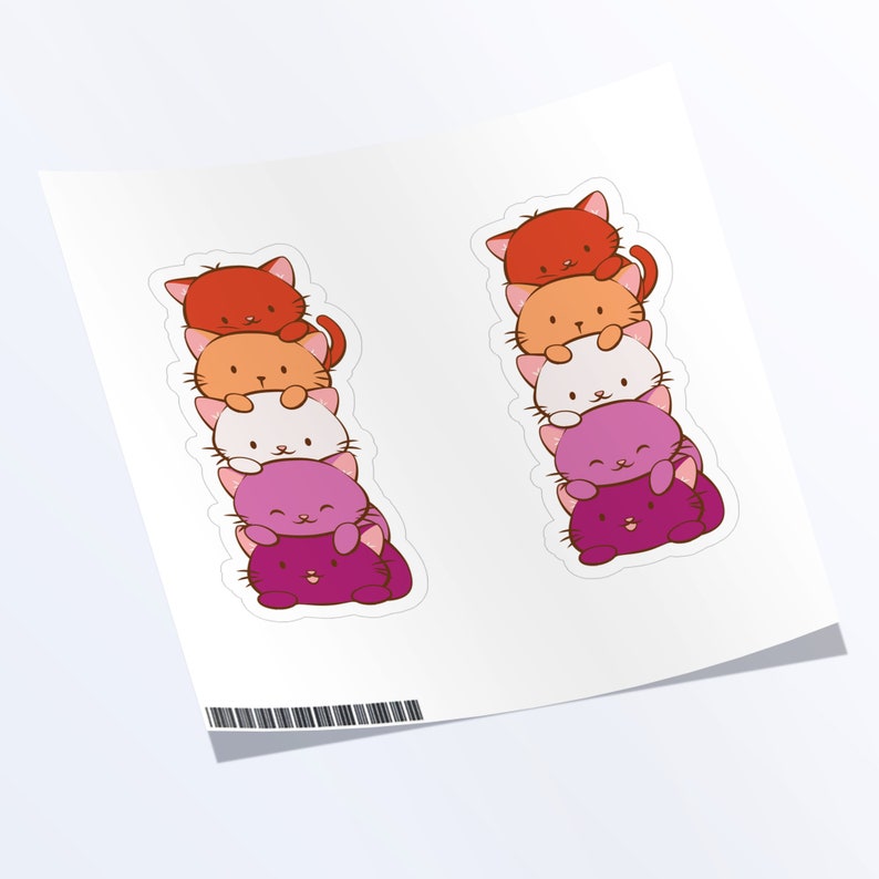 May include: Two stacks of five colorful cat stickers. Each stack is arranged from red to orange to white to purple to pink. The cats are all facing forward with their eyes closed and their mouths slightly open.