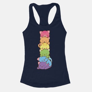 May include: Navy blue racerback tank top featuring a stack of six colorful cartoon cats. The cats are in shades of pink, orange, yellow, green, blue, and purple. The tank top has a scoop neck and a racerback design.