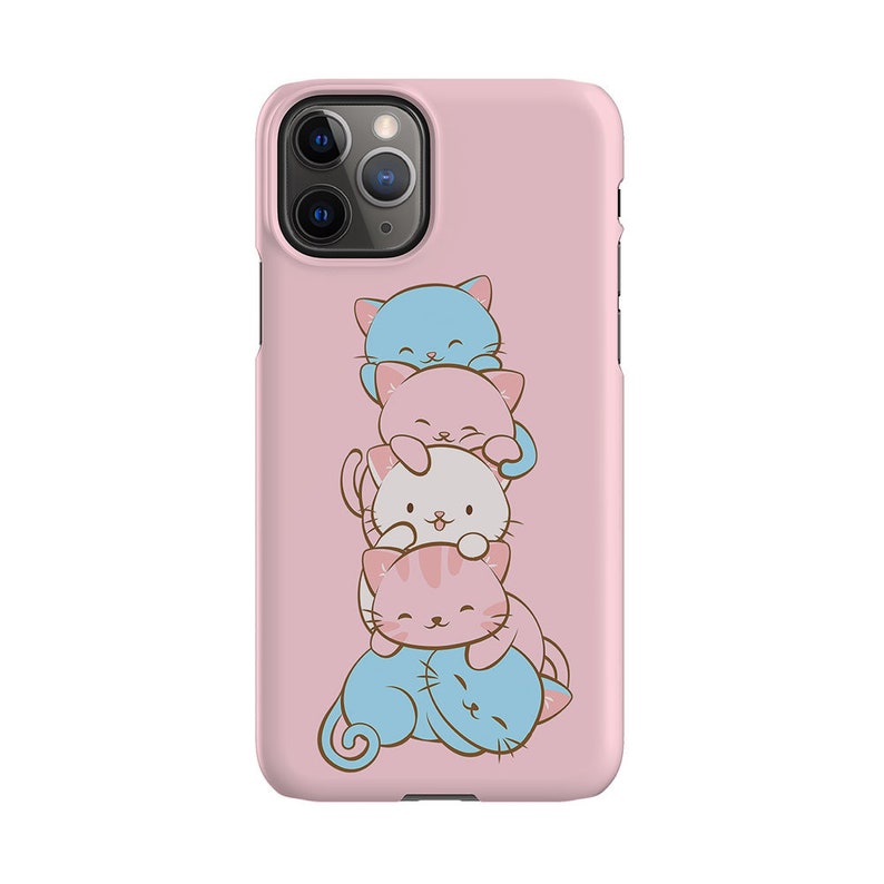 May include: A pink phone case featuring a stack of four cartoon cats. The cats are blue, pink, white, and pink with brown stripes. The cats are stacked on top of each other, with the blue cat on top and the pink and brown striped cat on the bottom.