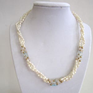 Triple-strand of Rice Pearl, Blue Topaz, Rose Quartz and Gold Bead ...