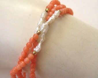 Circa 1960s 14K Yellow Gold Coral and Rice Pearl Twist Bracelet