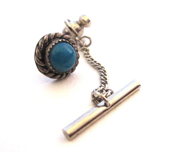 Silver tie pin with contrast colored stones