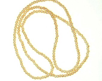 Collar de lazo con perlas artificiales de color rosa melocotón de los años 80