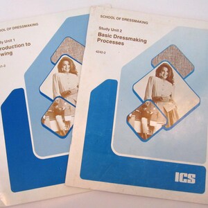 May include: Two vintage sewing books from the School of Dressmaking. The covers are white with blue accents and feature a photo of a woman. The titles are "Study Unit 1 Introduction to Sewing" and "Study Unit 2 Basic Dressmaking Processes."