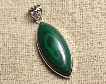 May include: A green malachite gemstone pendant with a silver setting. The pendant is oval shaped and has a swirl pattern.