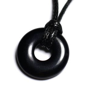 May include: A black obsidian donut pendant on a black cord necklace.