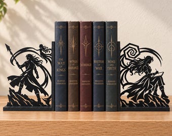 May include: A set of black metal bookends featuring intricate silhouettes of fantasy characters, flanking five hardcover books titled The Way of Kings, Words of Radiance, Oathbringer, Rhythm of War, and Wind and Truth by Brandon Sanderson.