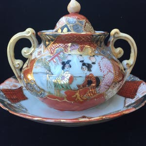 Antique Mustard Pot, Nippon Satsuma Hand Painted Porcelain Double Handled with Lid and Attached Saucer, Raised Gilding.