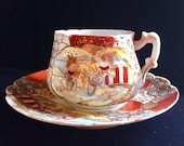 Antique Nippon Satsuma Hand Painted Porcelain Tea Cup and Saucer Raised Gilding.