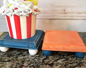 Tiered tray risers-lifts