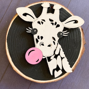 Giraffe ornament blowing bubble gum