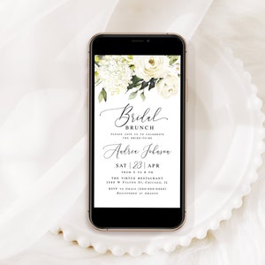 Pode incluir: Uma maquete de tela de telefone com um design floral branco e verde com um convite para um brunch de casamento. O convite diz "Bridal Brunch" e inclui o nome da noiva, "Andrea Johnson", a data "Sat | 23 | Apr", a hora "From 5 to 8 PM", o local "The Virtue Restaurant", o endere&ccedil;o "1340 W Fulton St, Chicago, IL", o n&uacute;mero de RSVP "(800) 300-0000" e as informa&ccedil;&otilde;es de registro "Registered at Amazon".