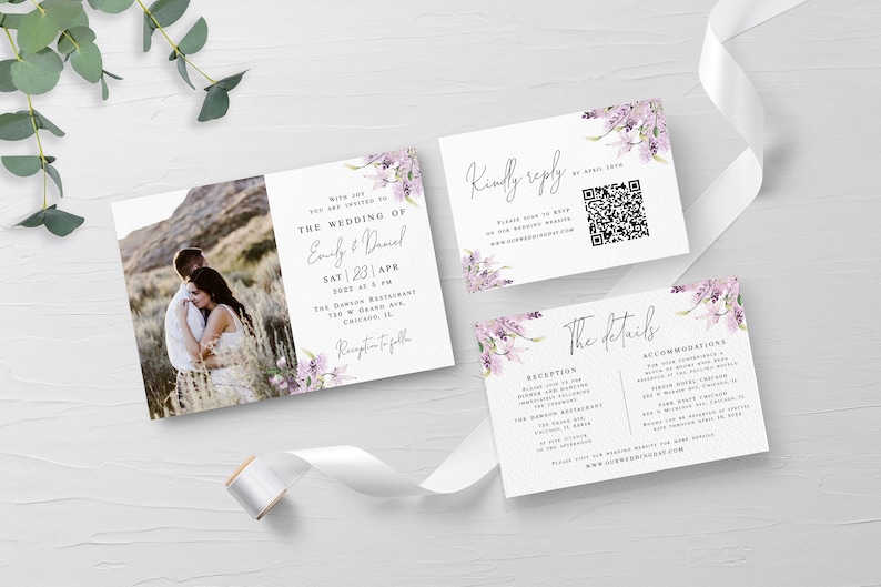 May include: Wedding invitation suite with a floral design. The invitation features a photo of a couple in a field, the text "The Wedding of Emily & Daniel", and the date "Sat 23 Apr 2023". The RSVP card includes a QR code and the text "Kindly reply by April 15th". The details card includes the text "The details" and information about the reception and accommodations.
