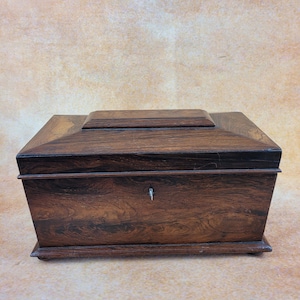 Antique Georgian era Tea Caddy, Sarcophagus shaped.  Walnut and mahogany. Circa 1830.