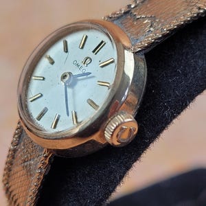 Vintage 9ct Gold Ladies Omega wristwatch and bracelet strap.