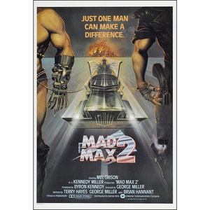 May include: A movie poster for the film Mad Max 2, featuring Mel Gibson as Max Rockatansky. The poster has a dark, gritty aesthetic with a futuristic car in the center. The text on the poster reads "Just one man can make a difference." and "Mad Max 2".