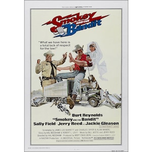 May include: A movie poster for the film "Smokey and the Bandit" featuring Burt Reynolds, Sally Field, and Jackie Gleason. The poster has a yellow background with a lightning bolt and the title in red and black. The tagline is "What we have here is a total lack of respect for the law!"