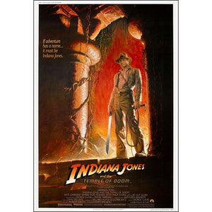 May include: A movie poster for Indiana Jones and the Temple of Doom. The poster features Harrison Ford as Indiana Jones standing in a doorway with a machete and a whip. The text on the poster reads "Indiana Jones and the Temple of Doom".